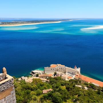 a building on the edge of a body of water