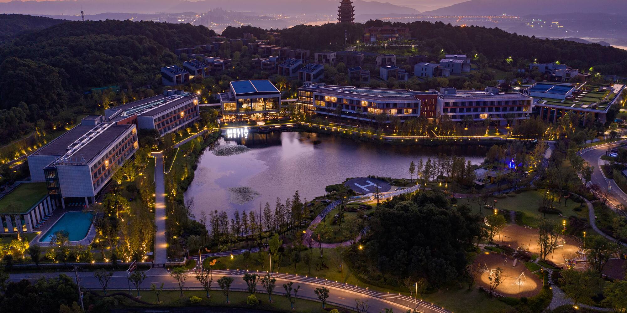 a city with a lake and trees