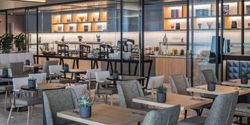 a restaurant with tables and chairs