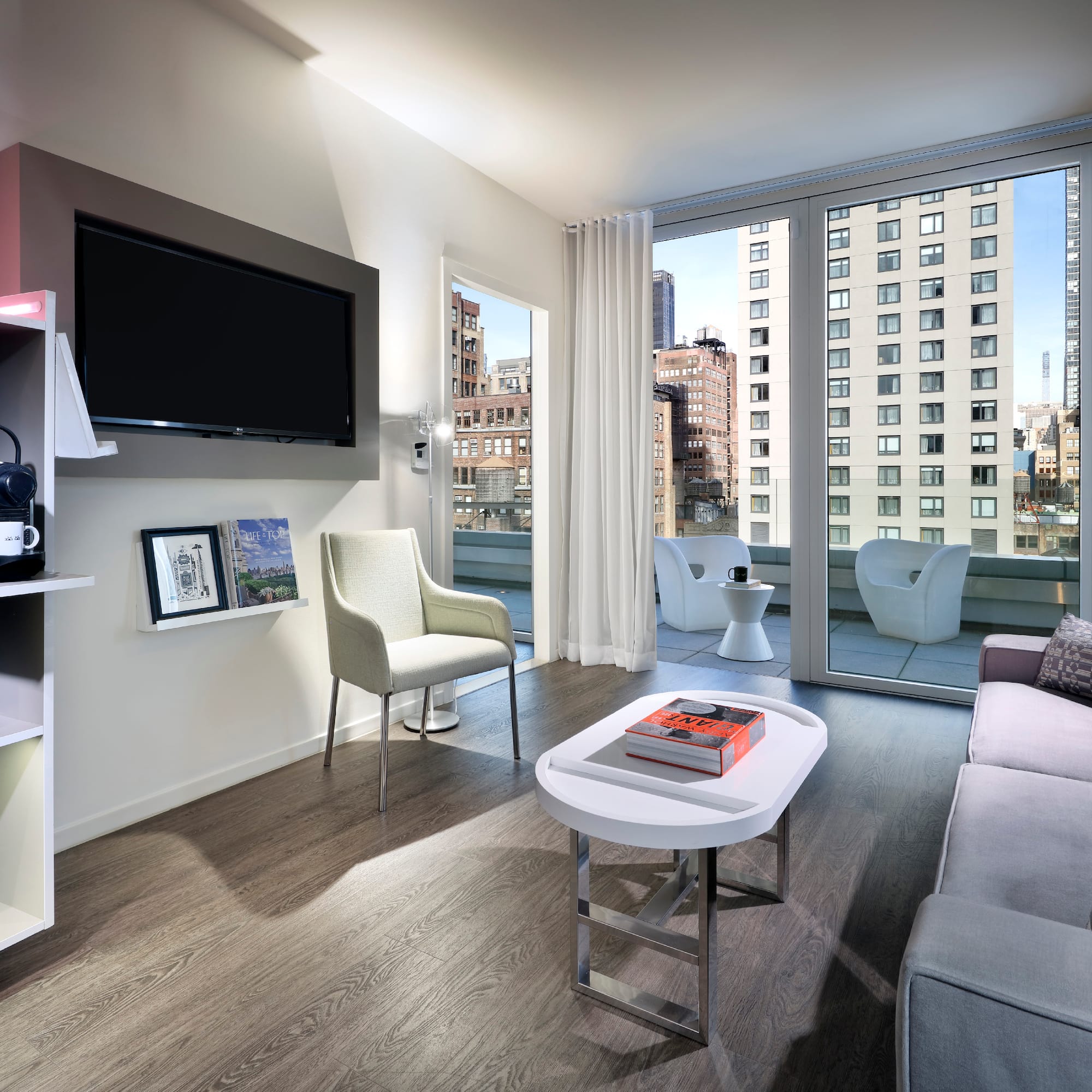 a living room with a television and a couch