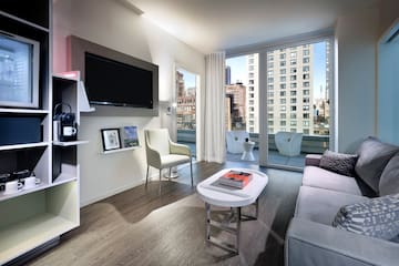 a living room with a television and a couch
