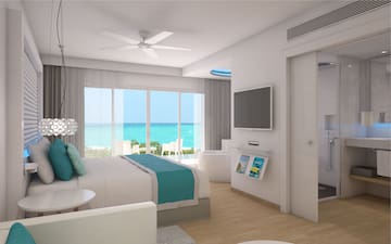 a bedroom with a television and a bathtub