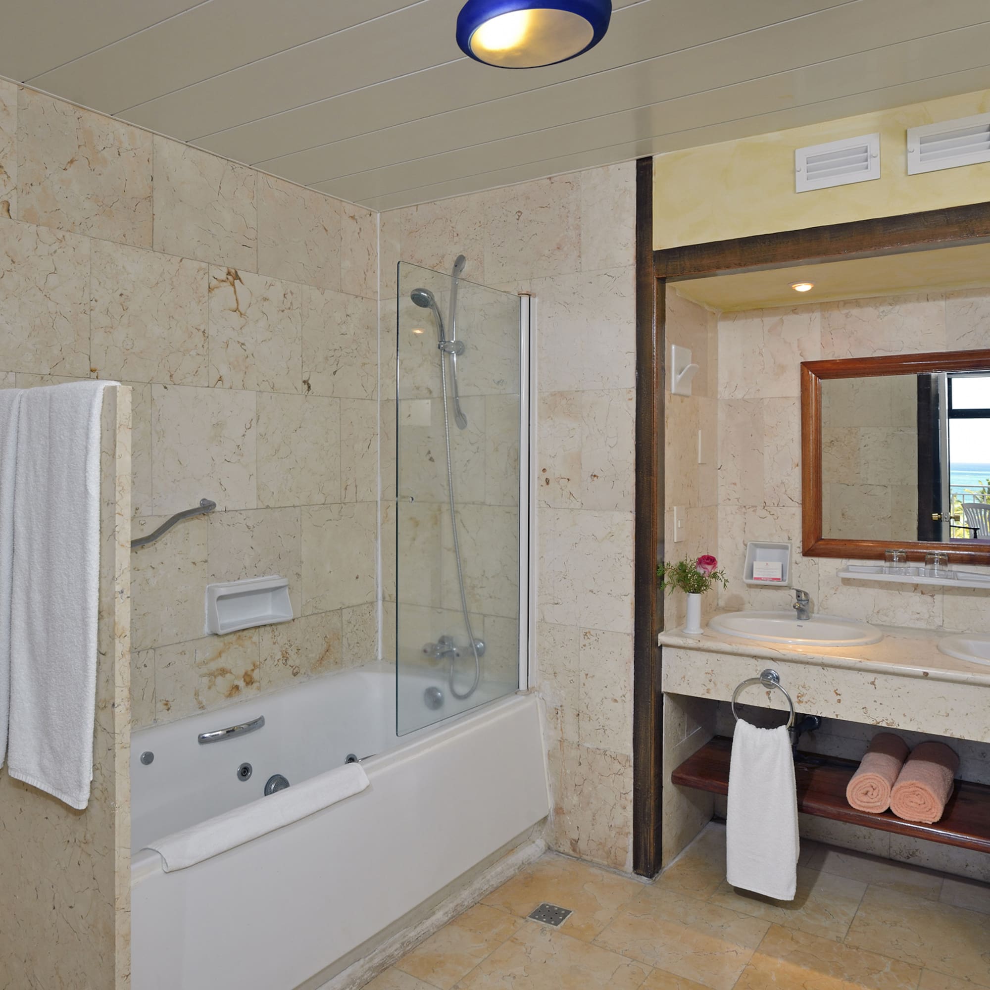 a bathroom with a bathtub and sink