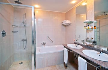 a bathroom with a shower and sink