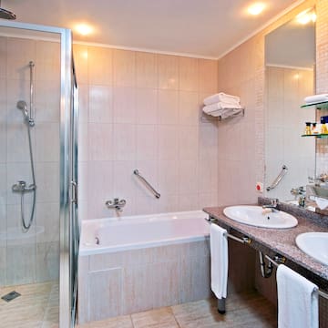 a bathroom with a shower and sink
