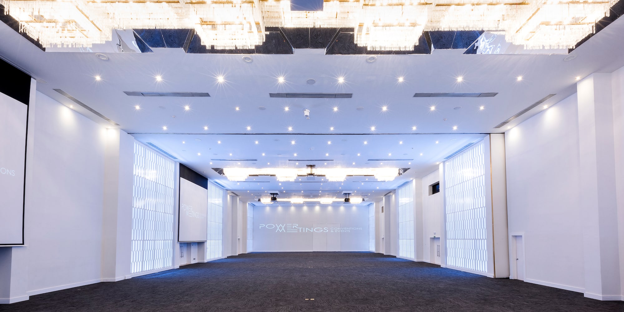 a room with a large ceiling and a large screen