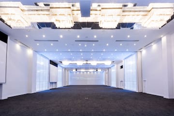 a room with a large ceiling and a large screen