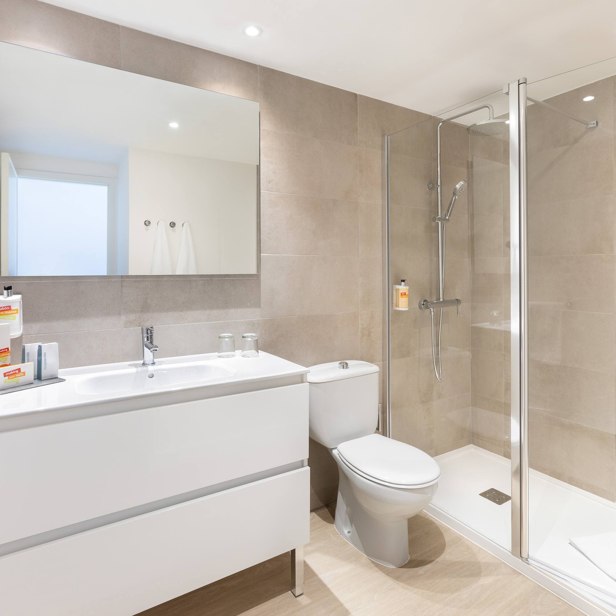 a bathroom with a shower and toilet