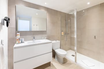 a bathroom with a shower and toilet