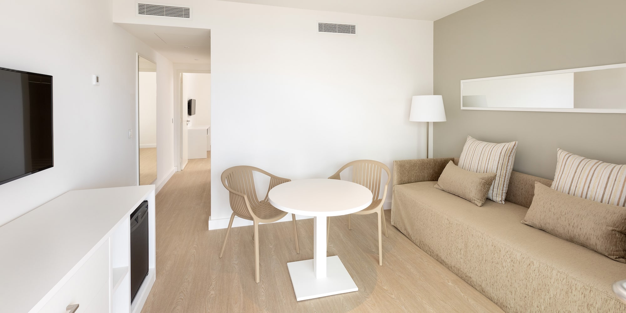 a room with a table and chairs