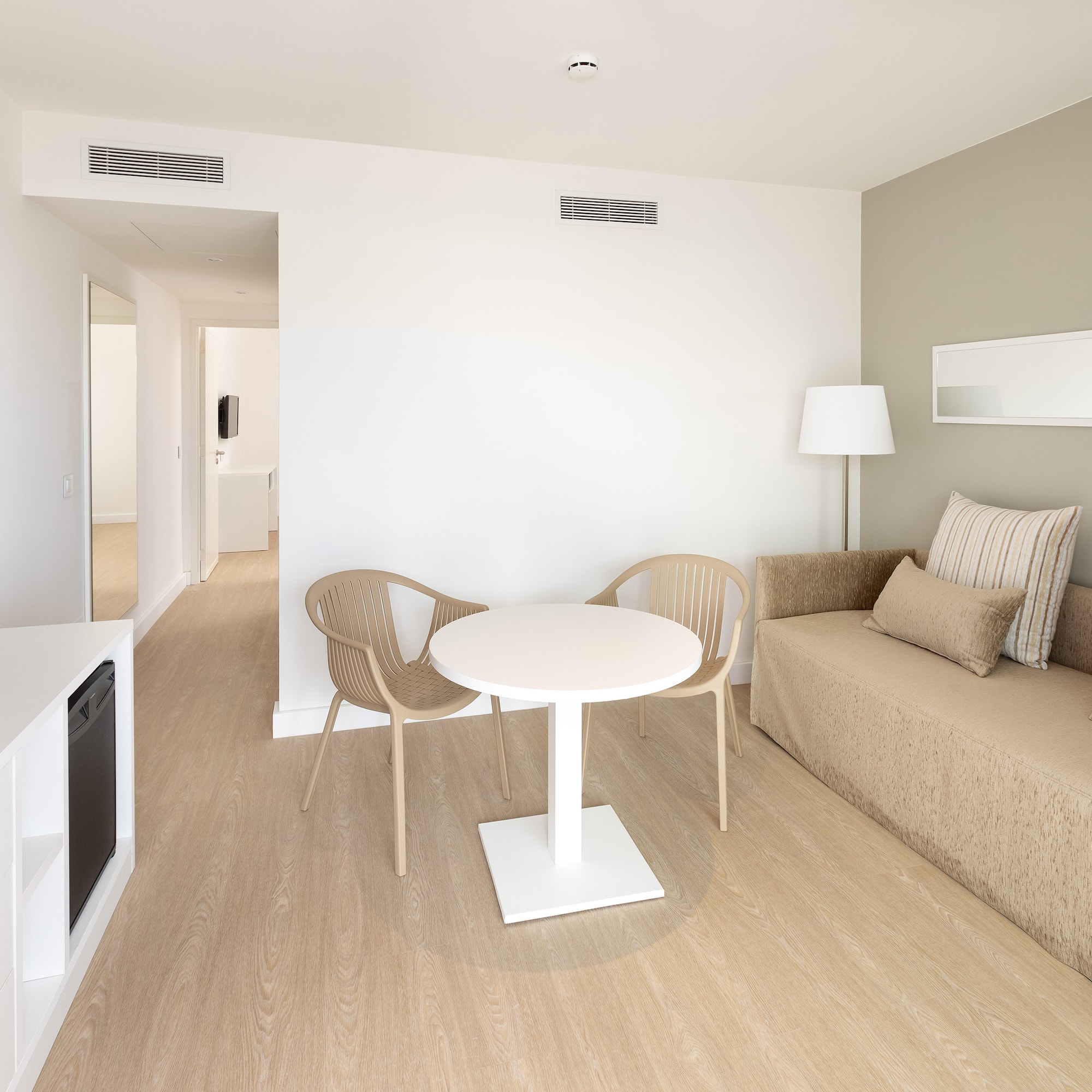 a room with a table and chairs