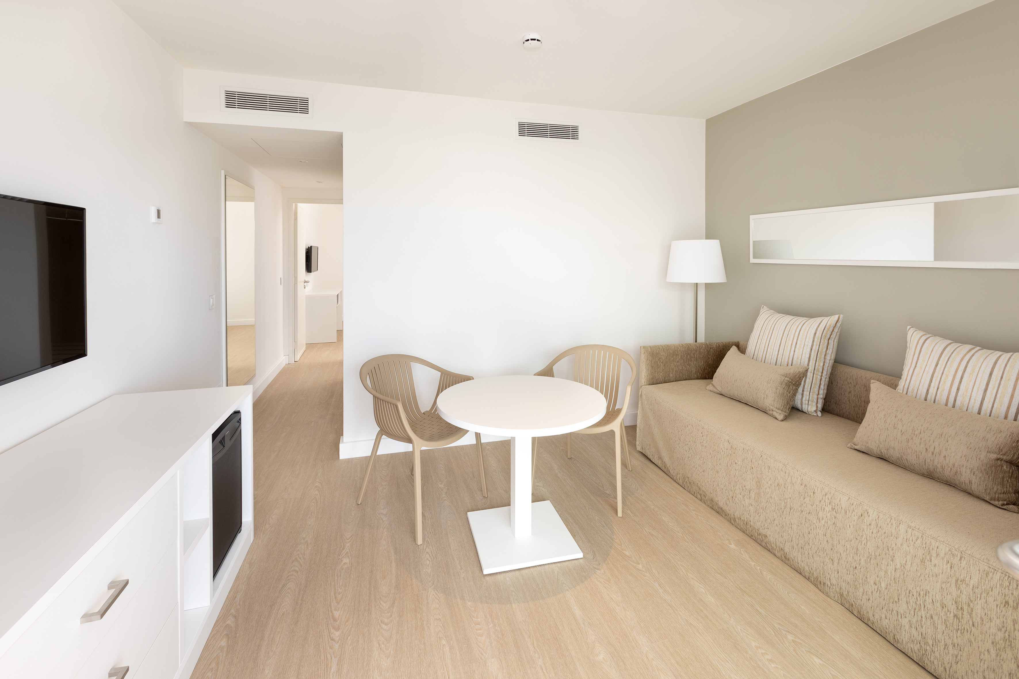 a room with a table and chairs