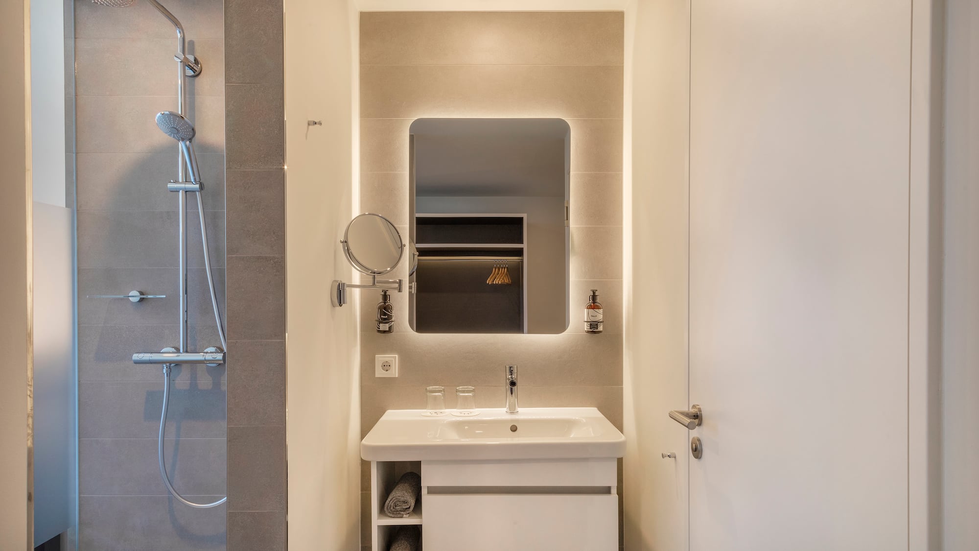 a bathroom with a mirror and sink