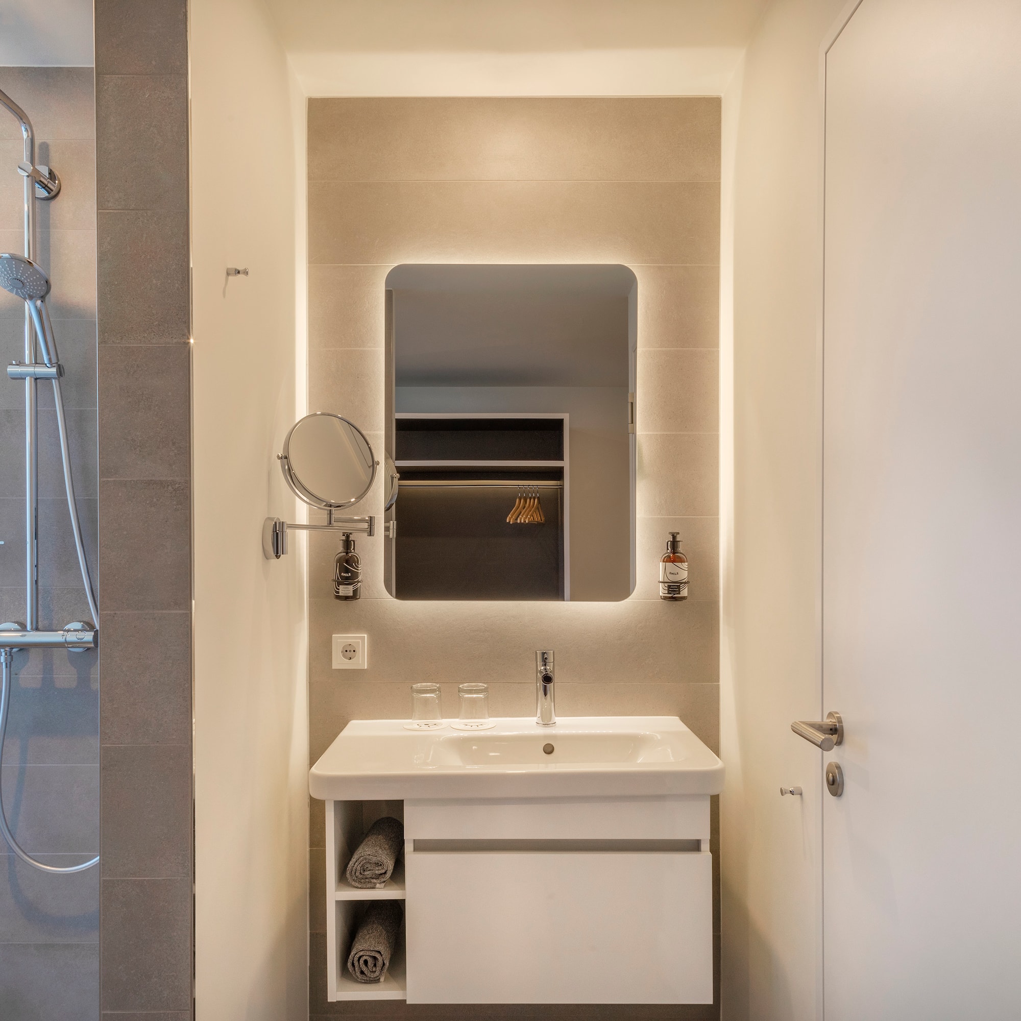 a bathroom with a mirror and sink