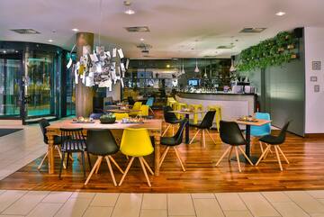 a restaurant with tables and chairs