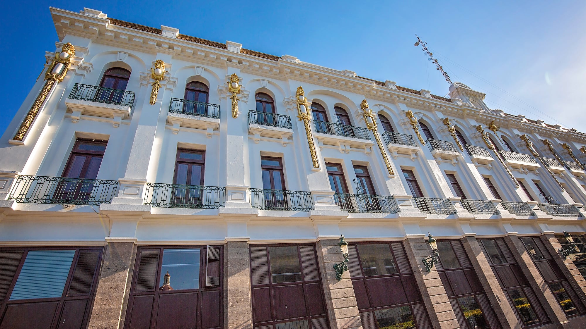 a white building with gold accents