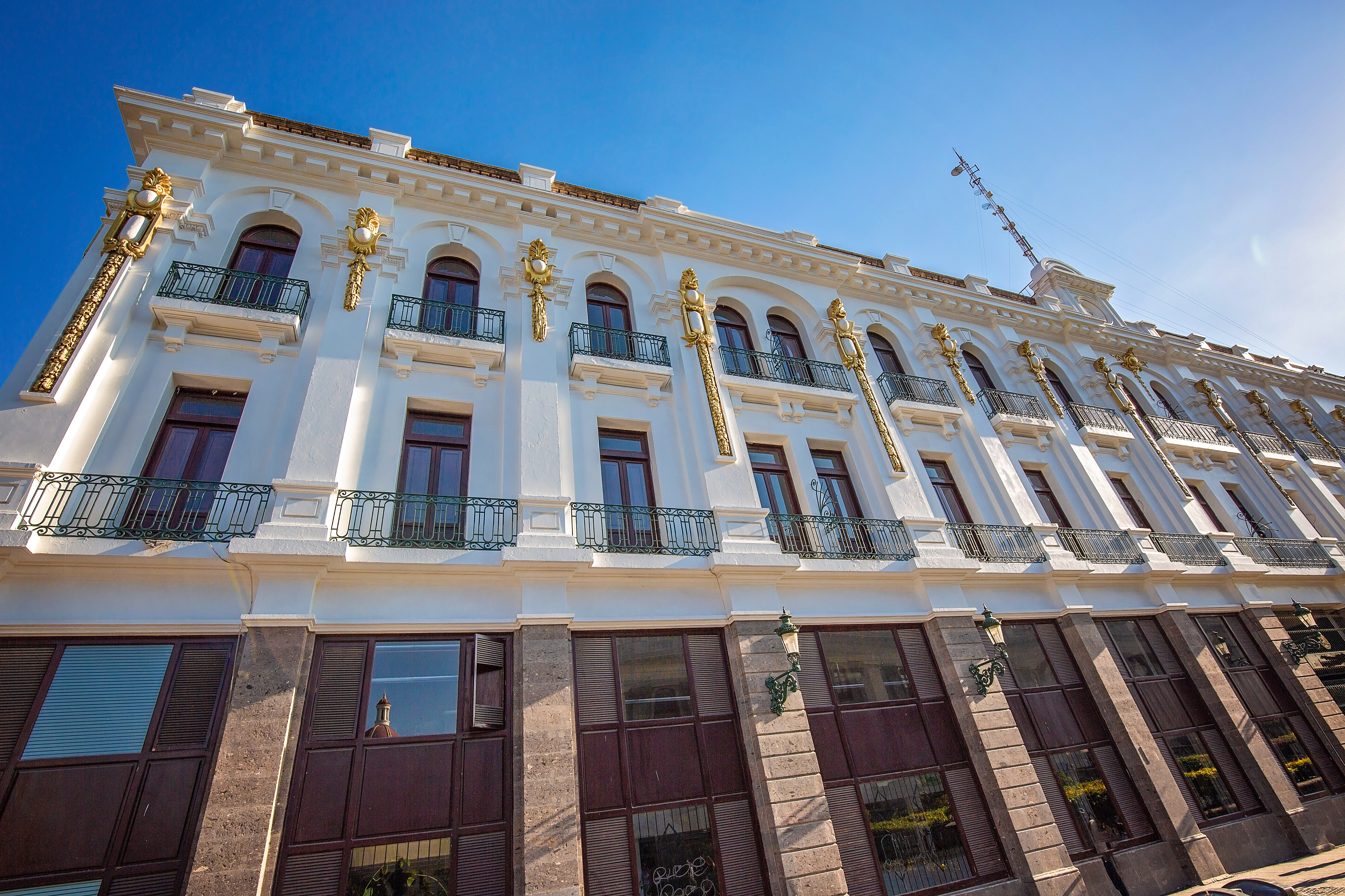 a white building with gold accents