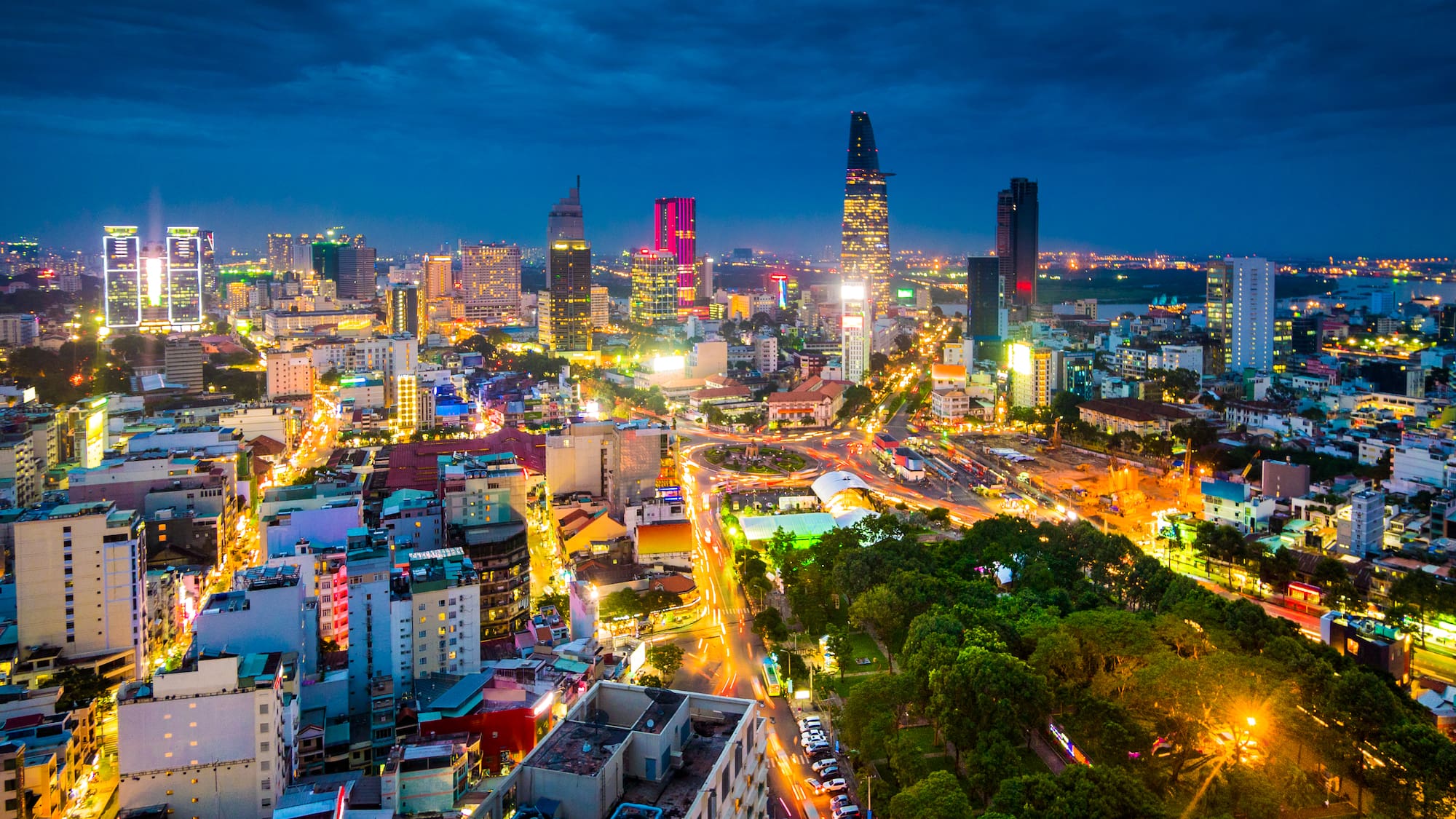 a city with many lights and trees