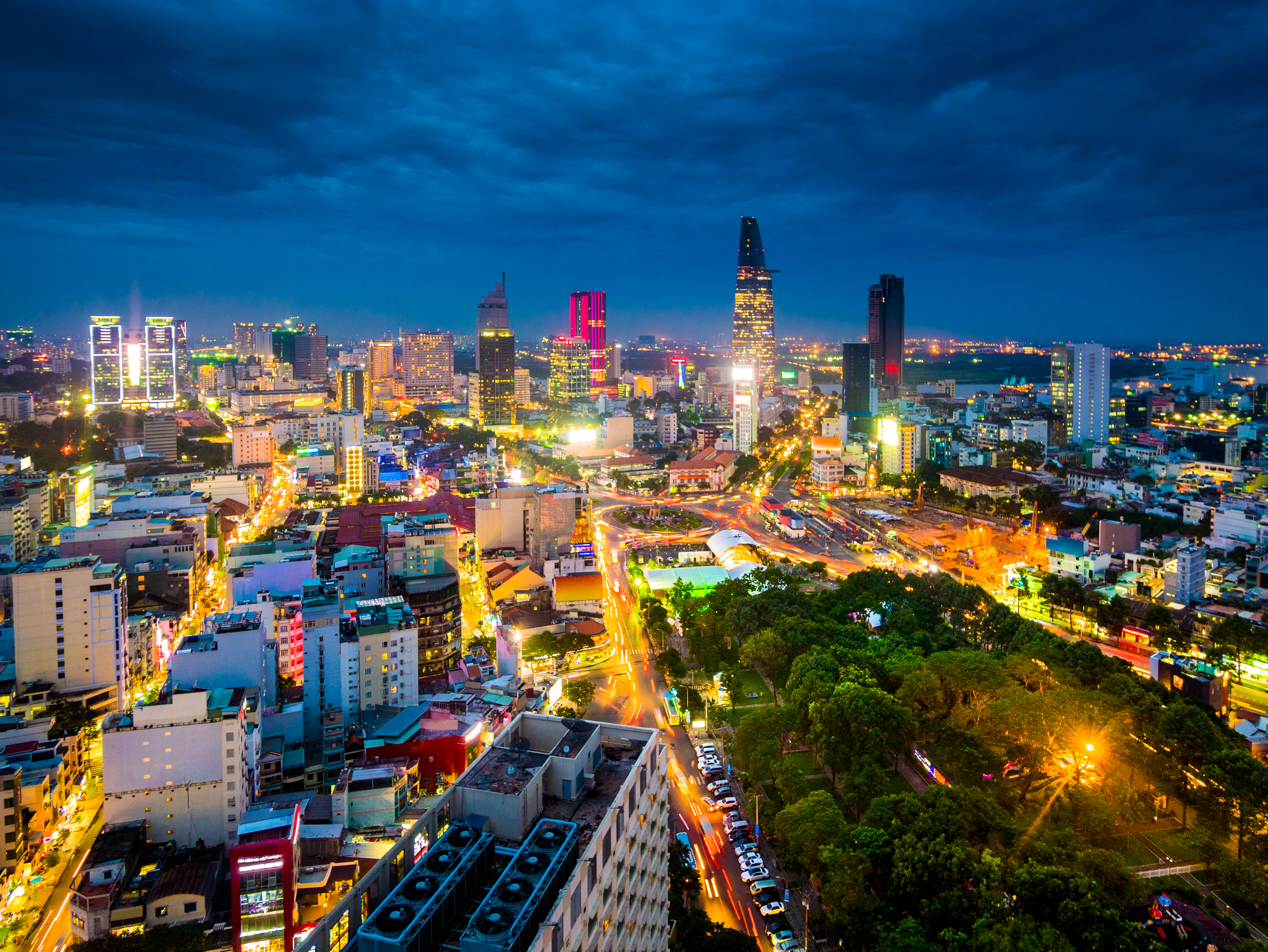 a city with many lights and trees