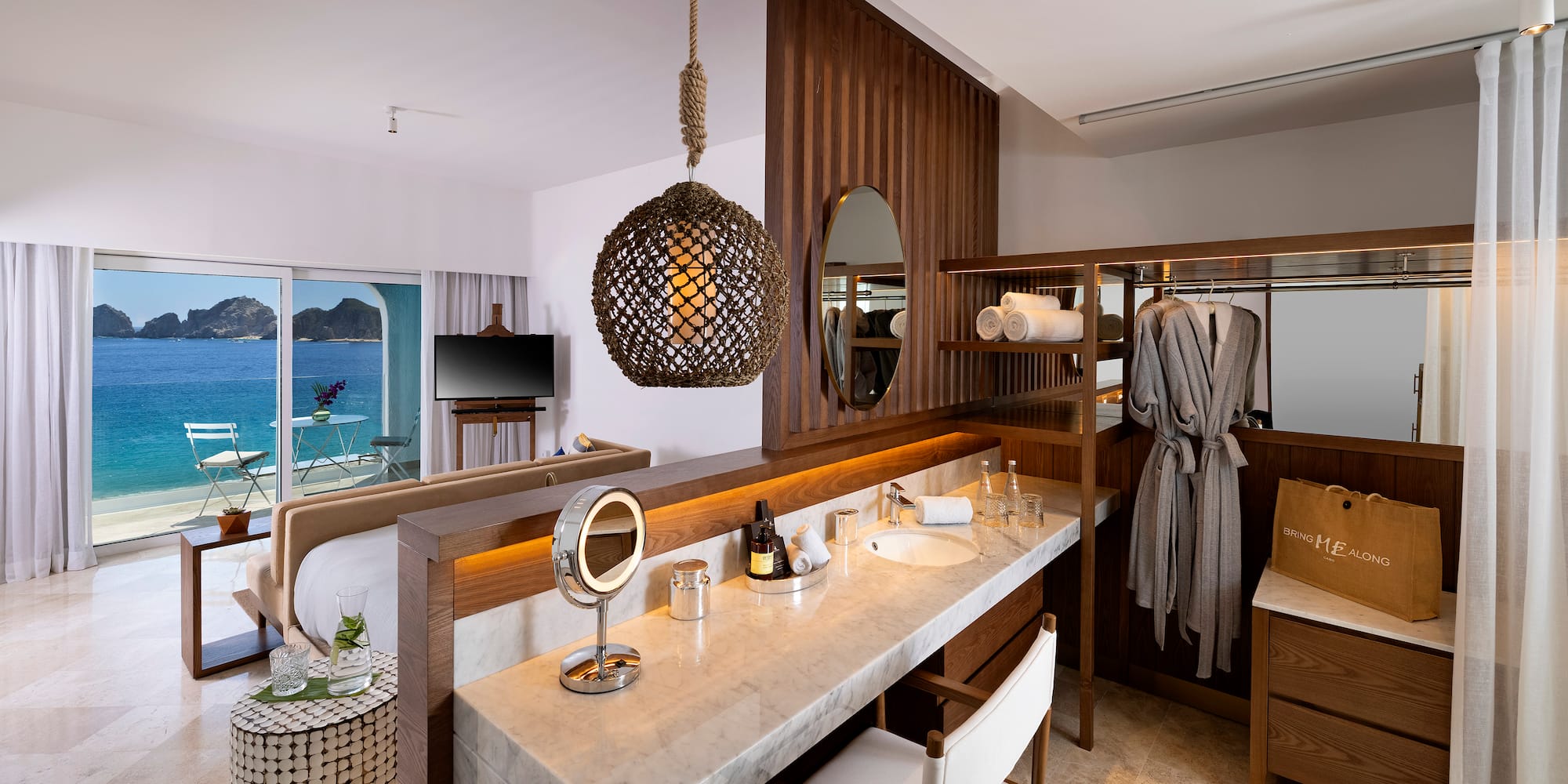 a bathroom with a mirror and a bathrobe