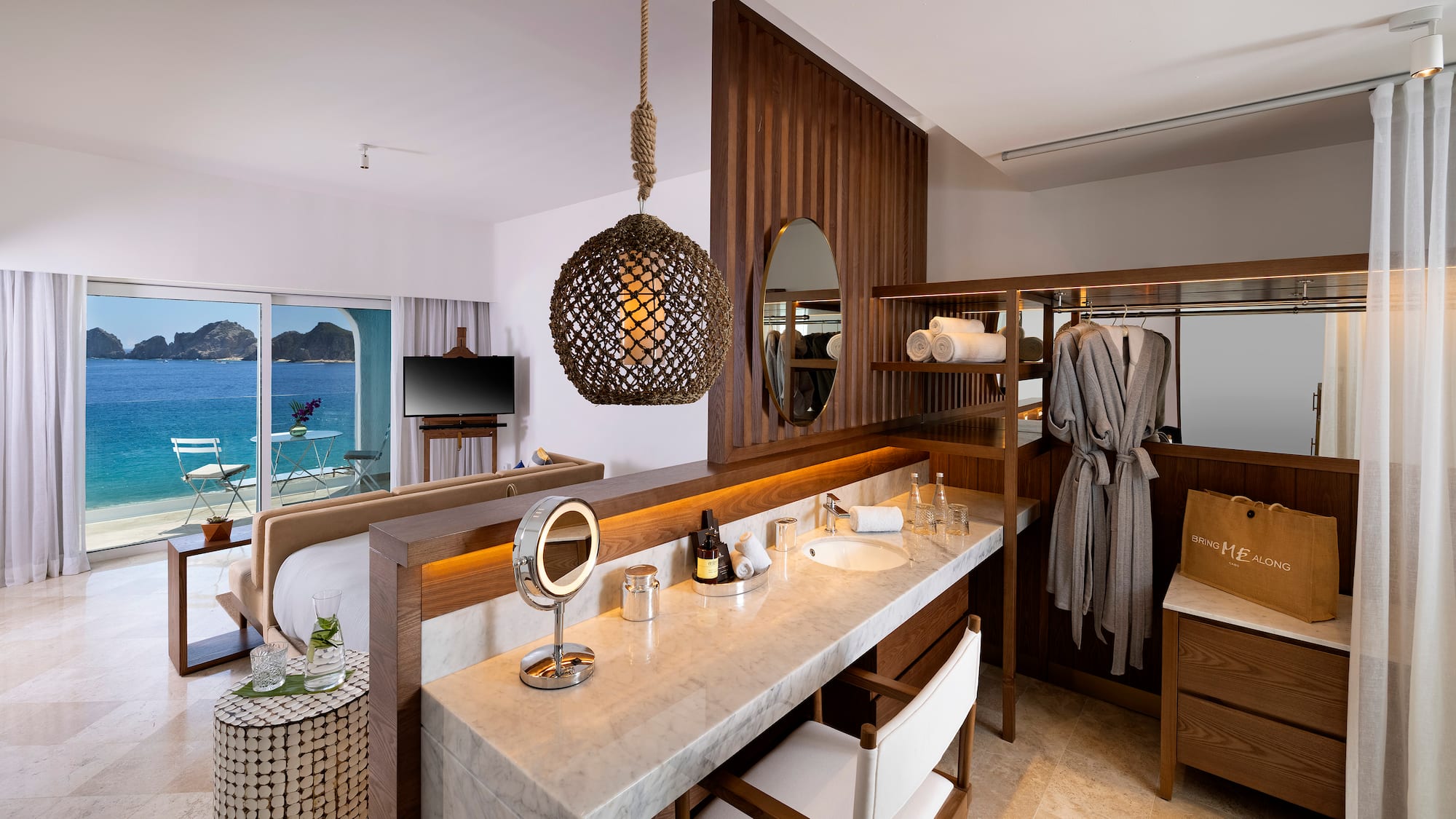 a bathroom with a mirror and a bathrobe