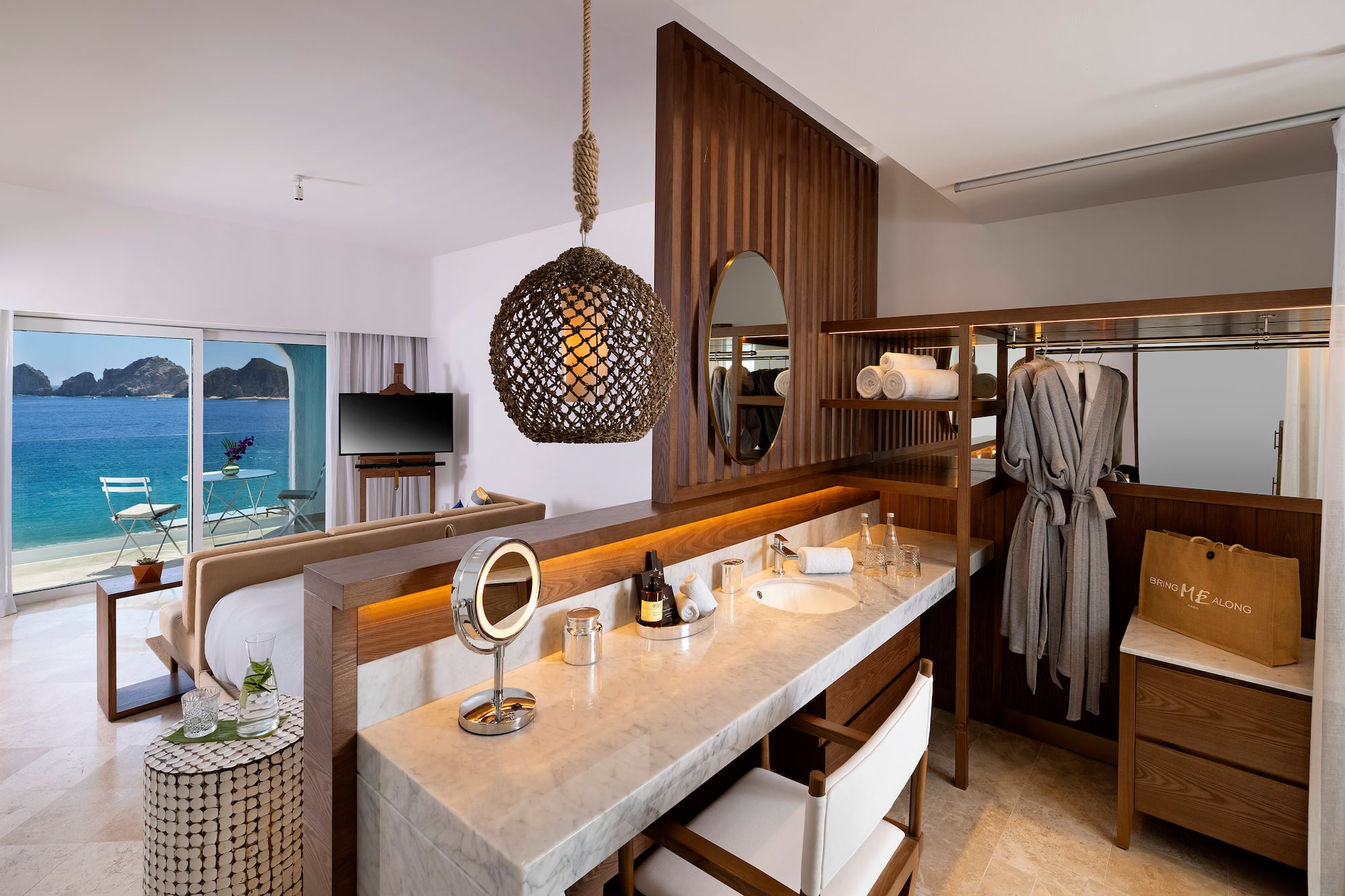 a bathroom with a mirror and a bathrobe