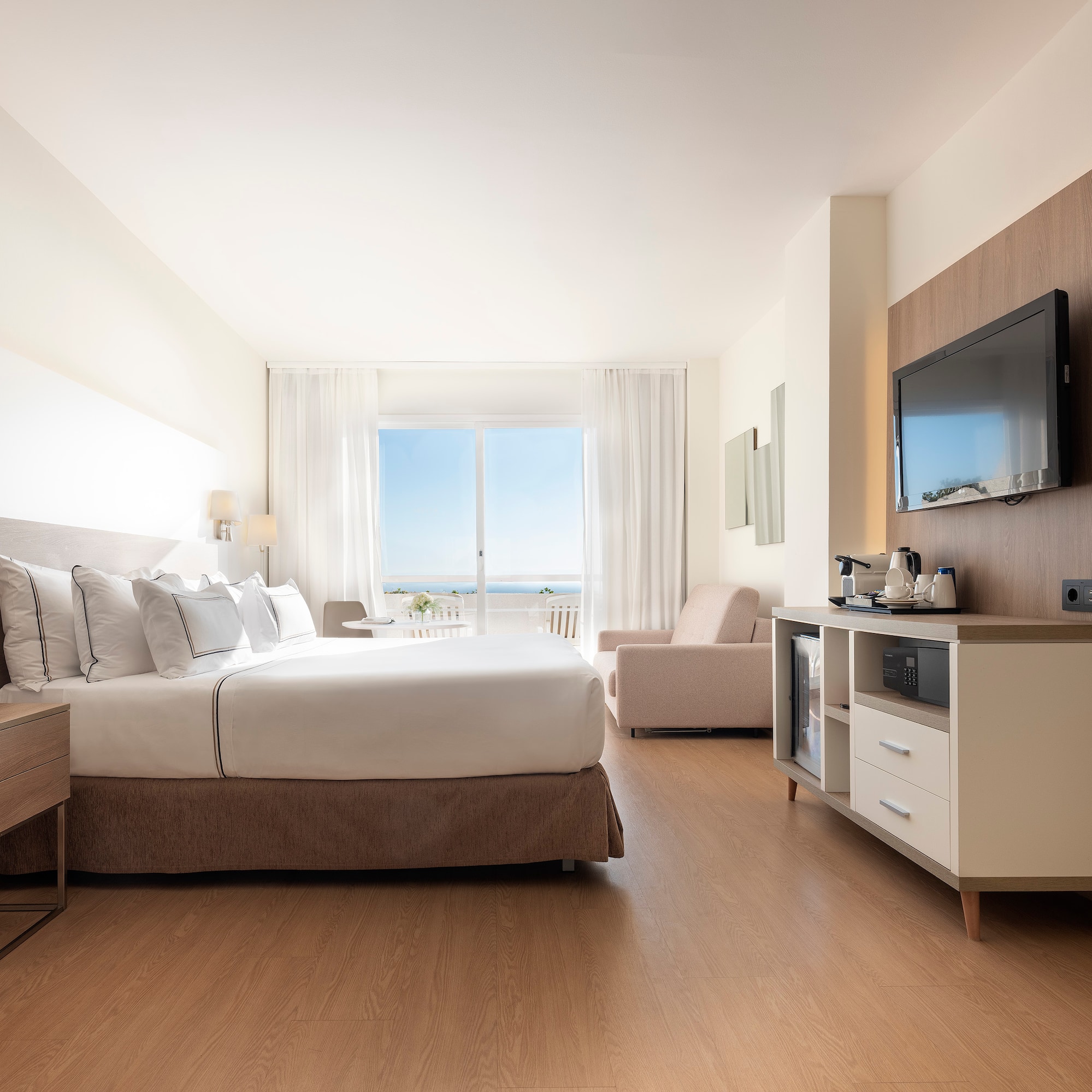 a room with a bed and a television