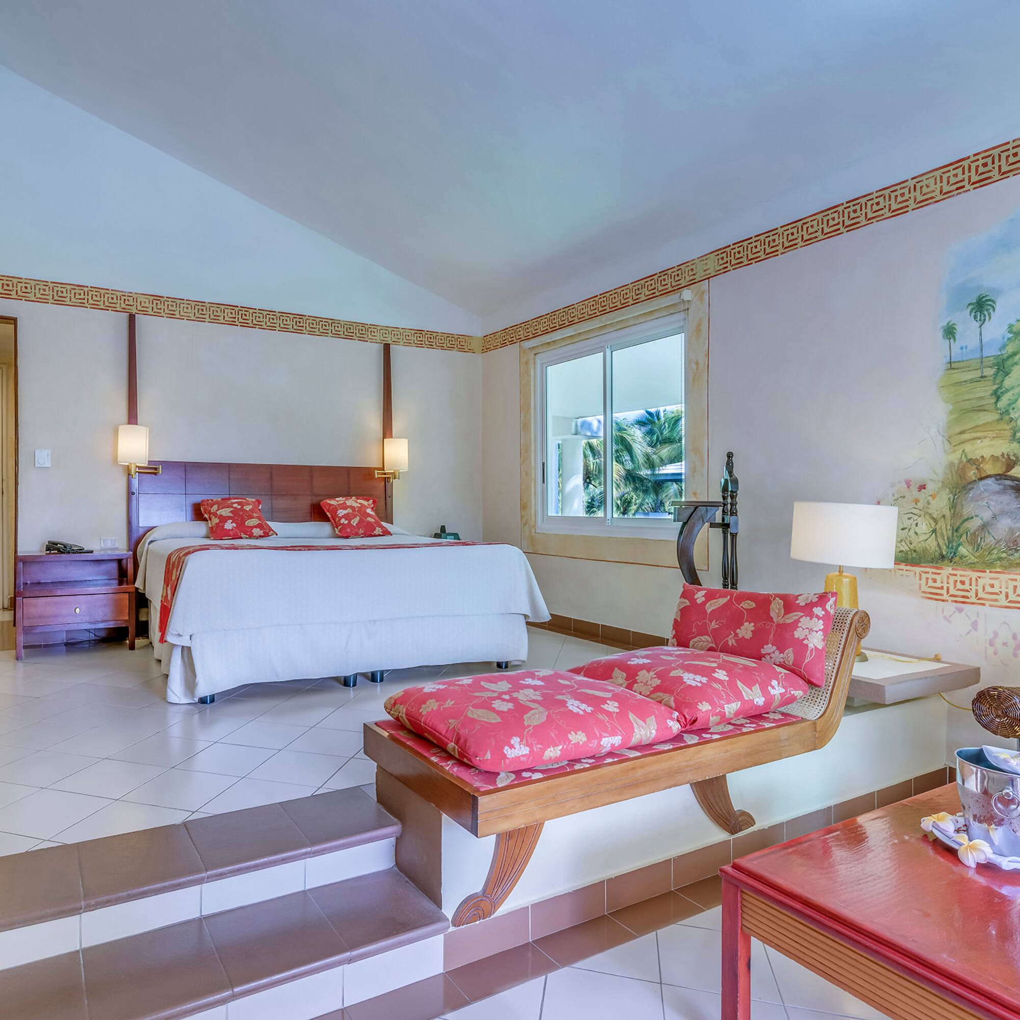 a bedroom with a bed and a table