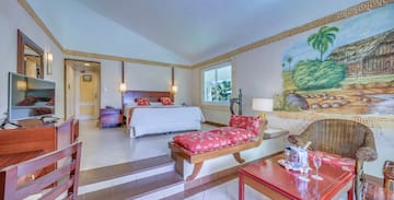 a bedroom with a bed and a table