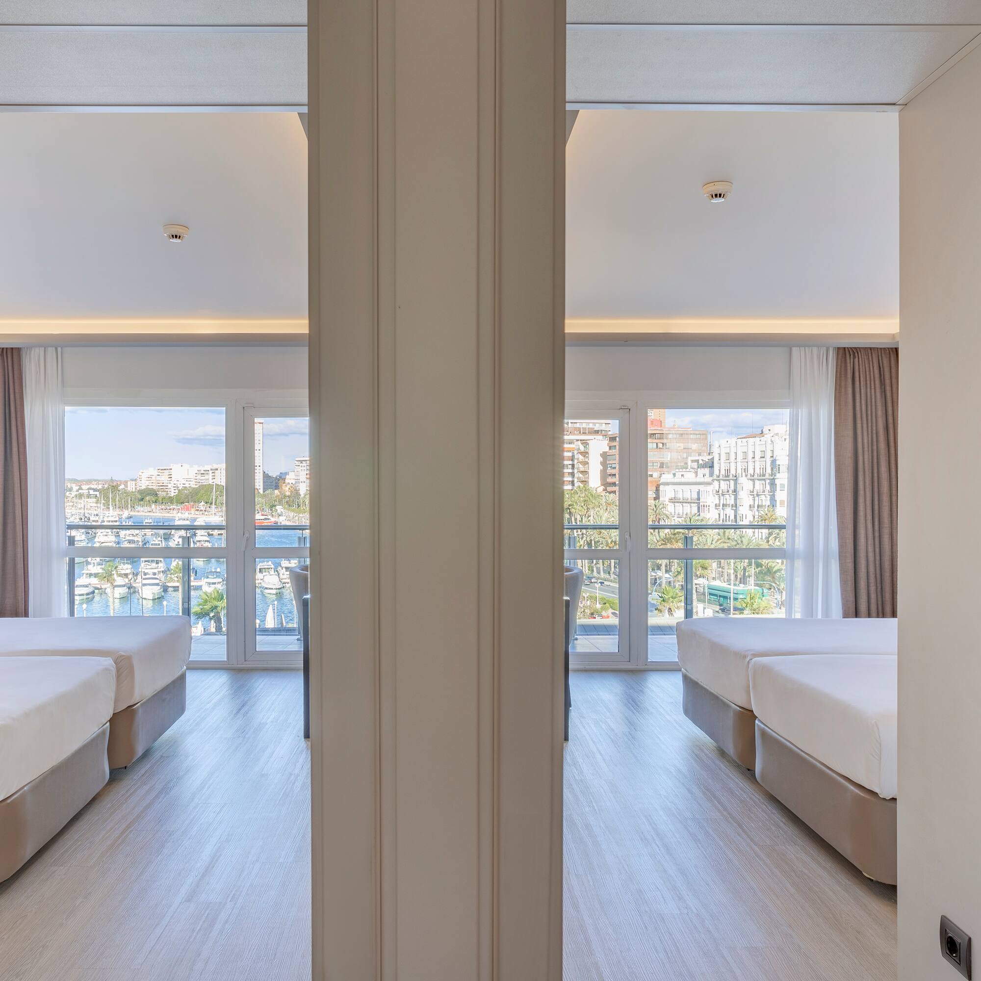 a room with two beds and a window