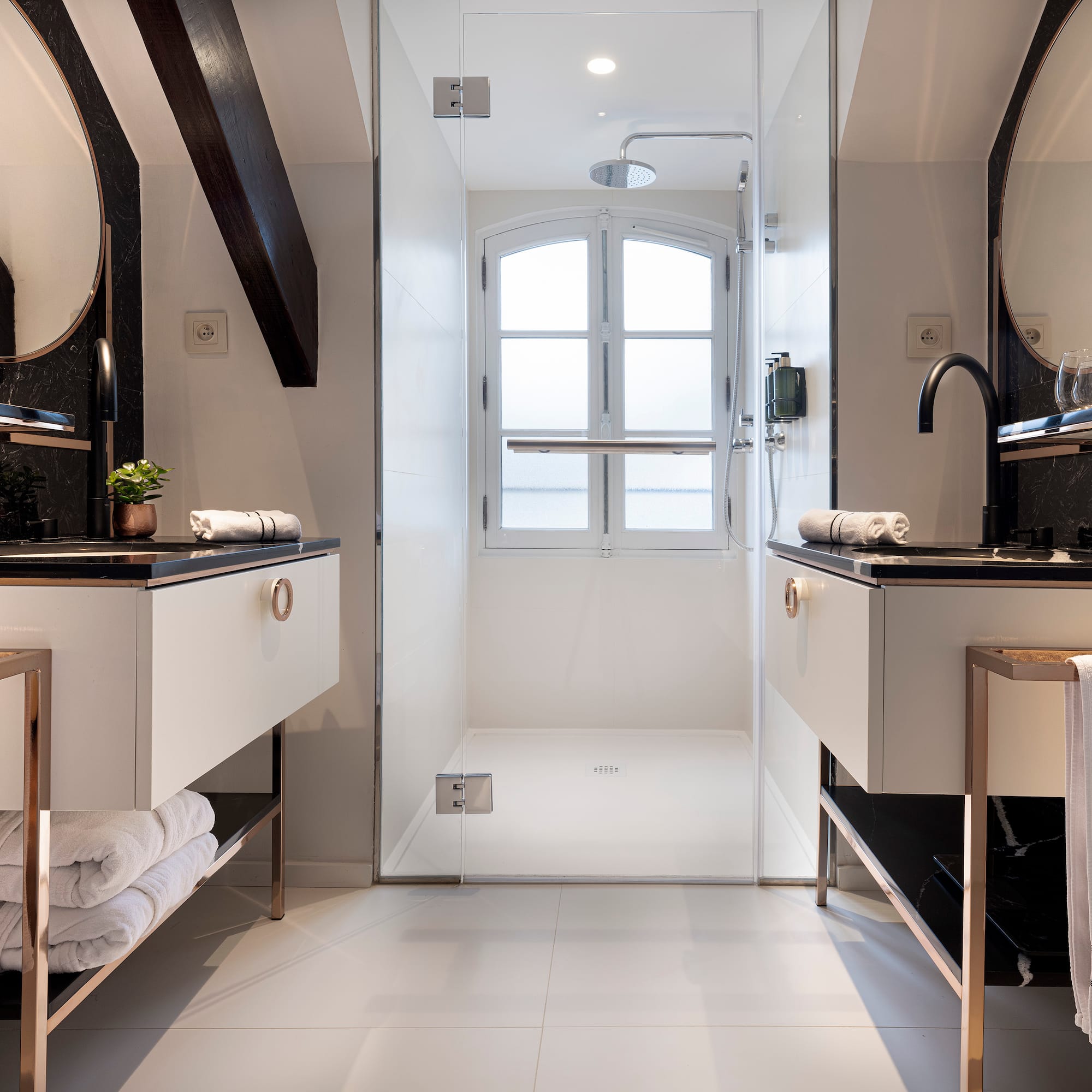 a bathroom with a shower and sink