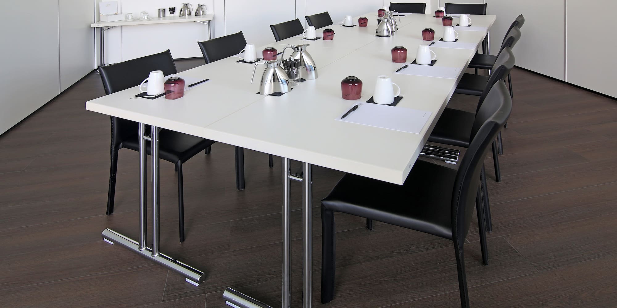 a table with chairs and a cup on it