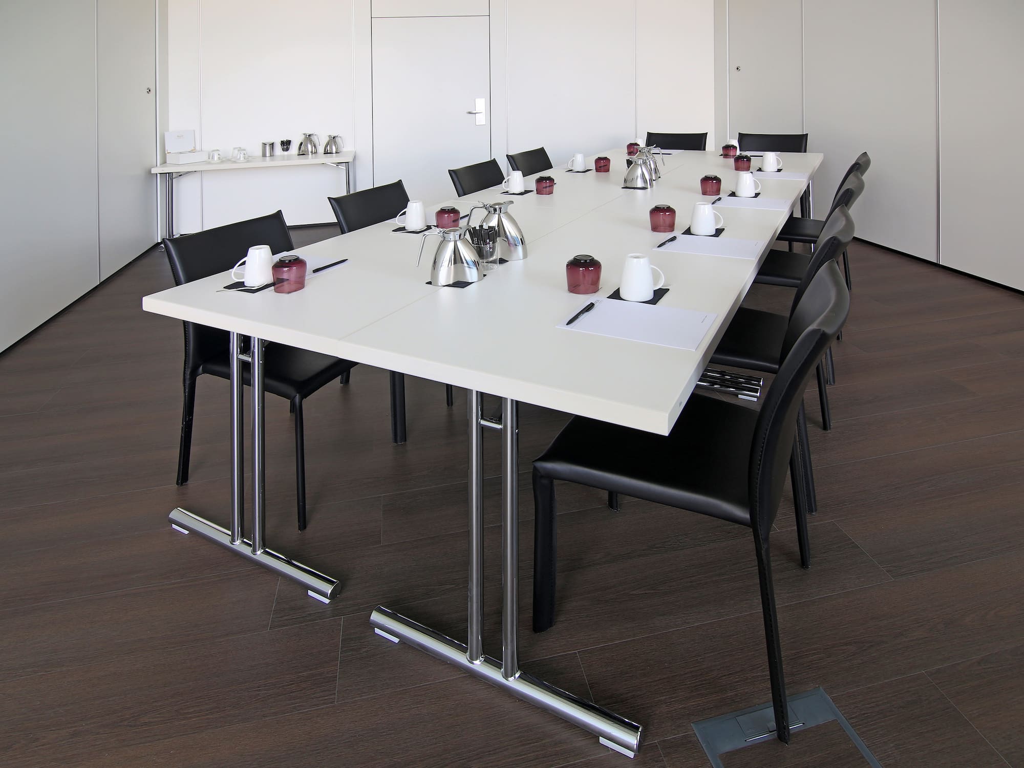 a table with chairs and a cup on it