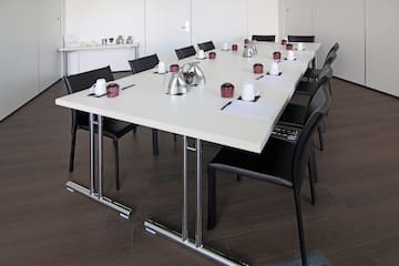 a table with chairs and a cup on it