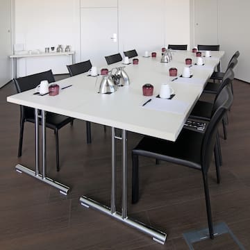 a table with chairs and a cup on it