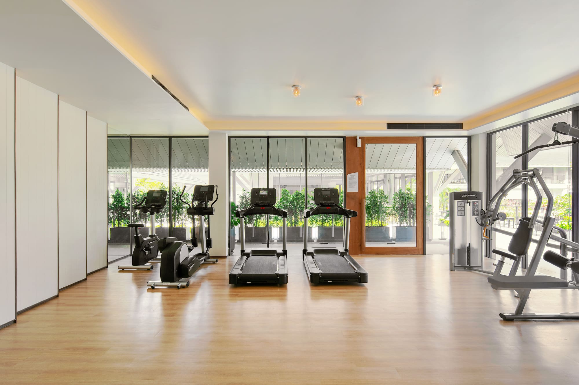 a room with treadmills and exercise equipment