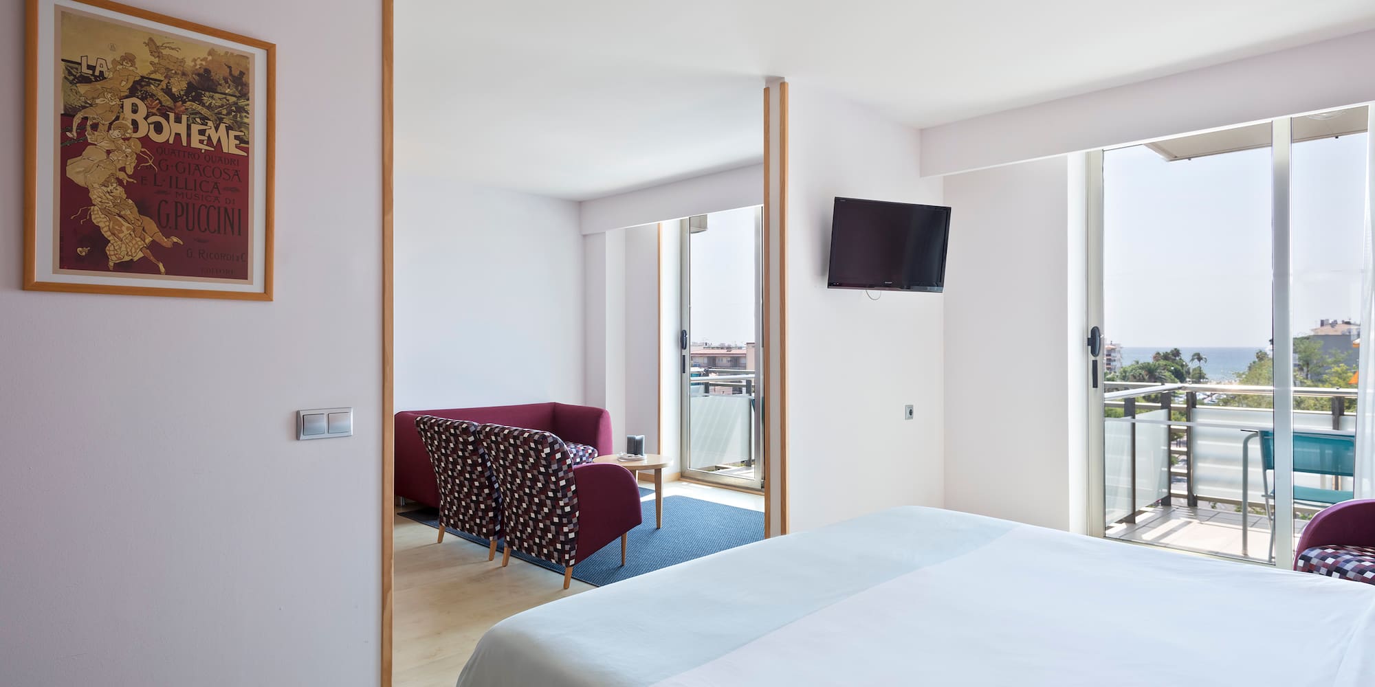 a bedroom with a bed and a television