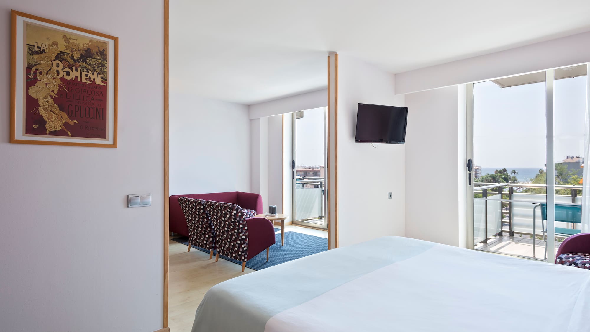 a bedroom with a bed and a television