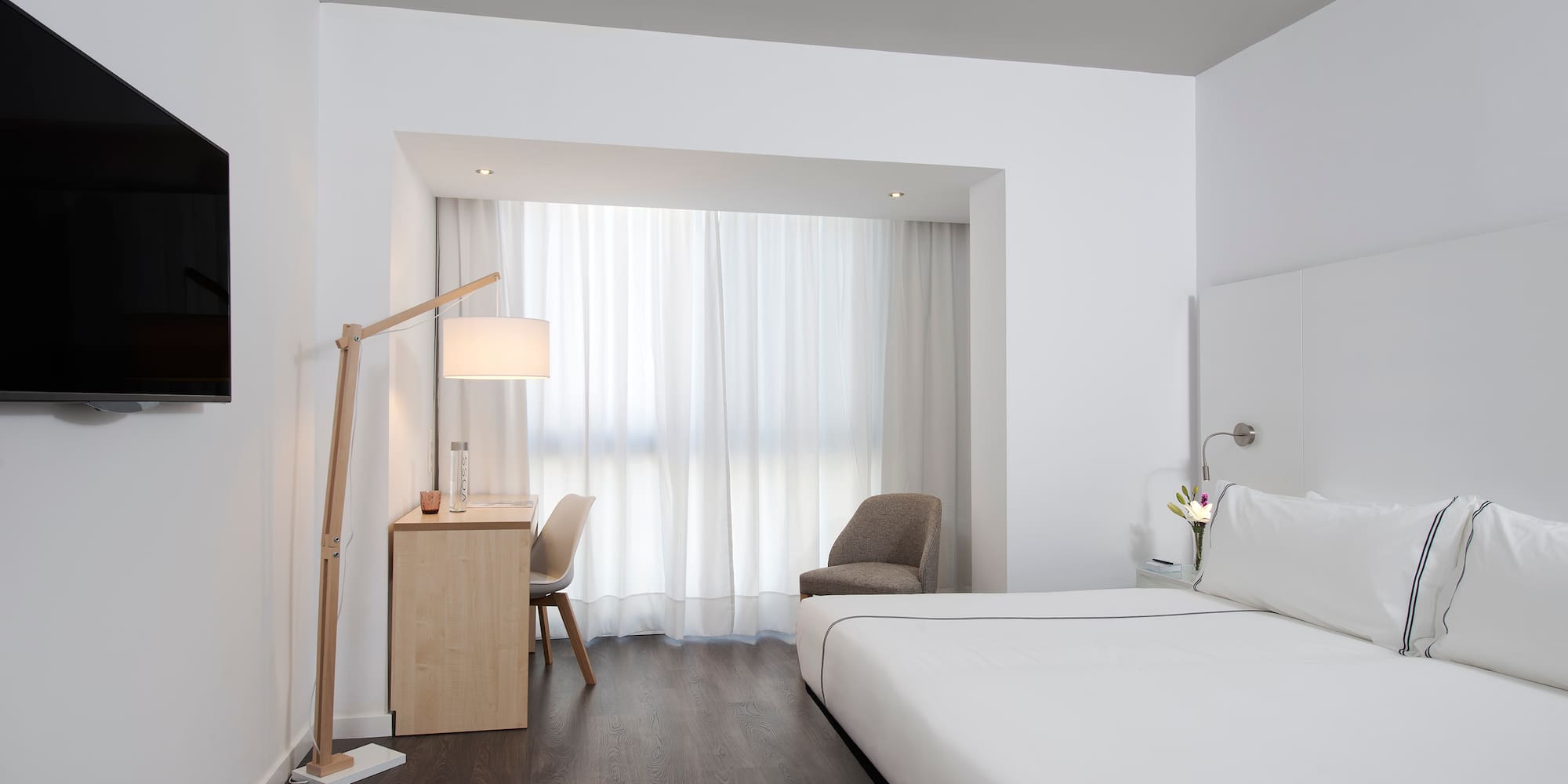 a room with a bed and a desk