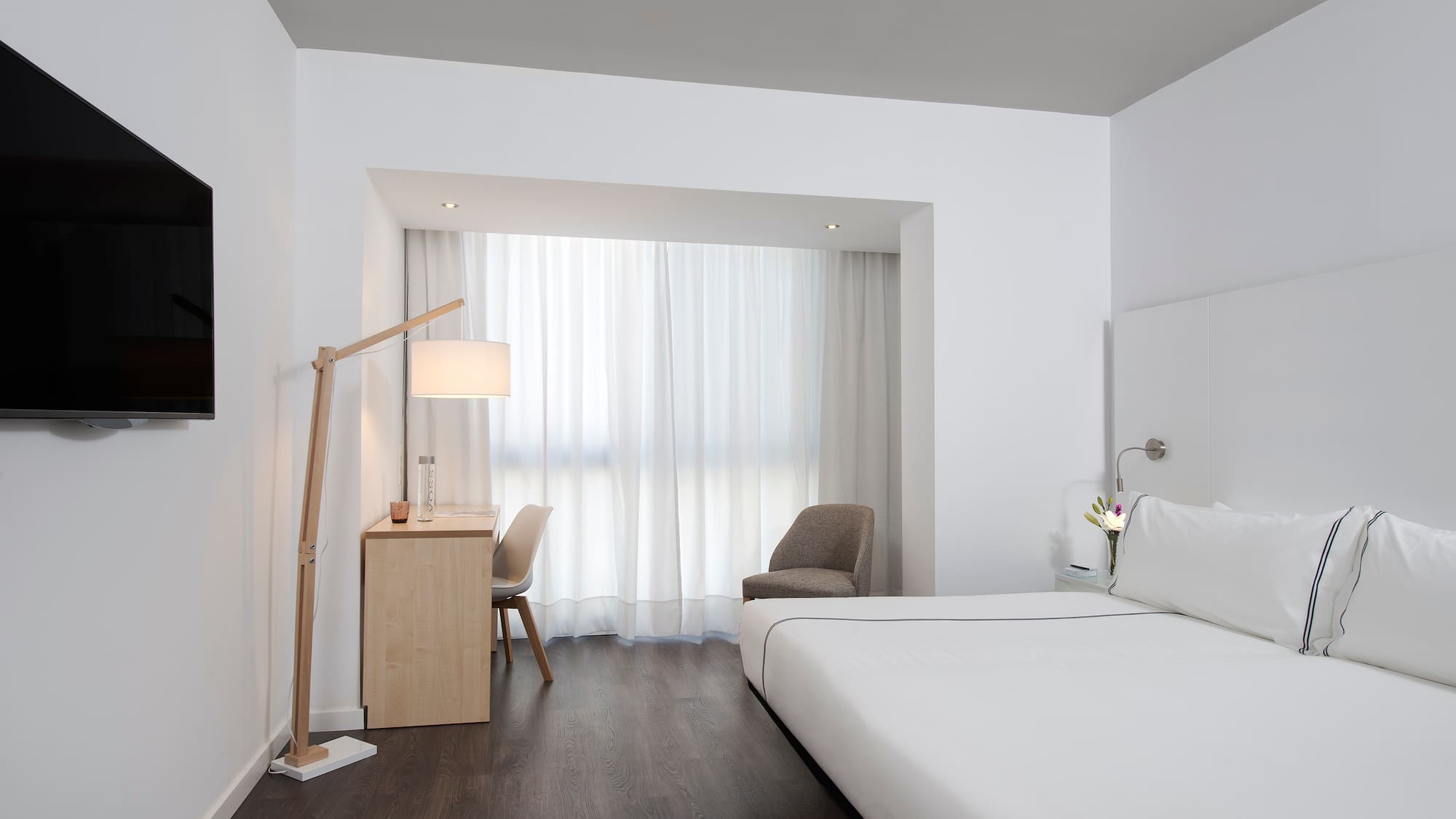 a room with a bed and a desk