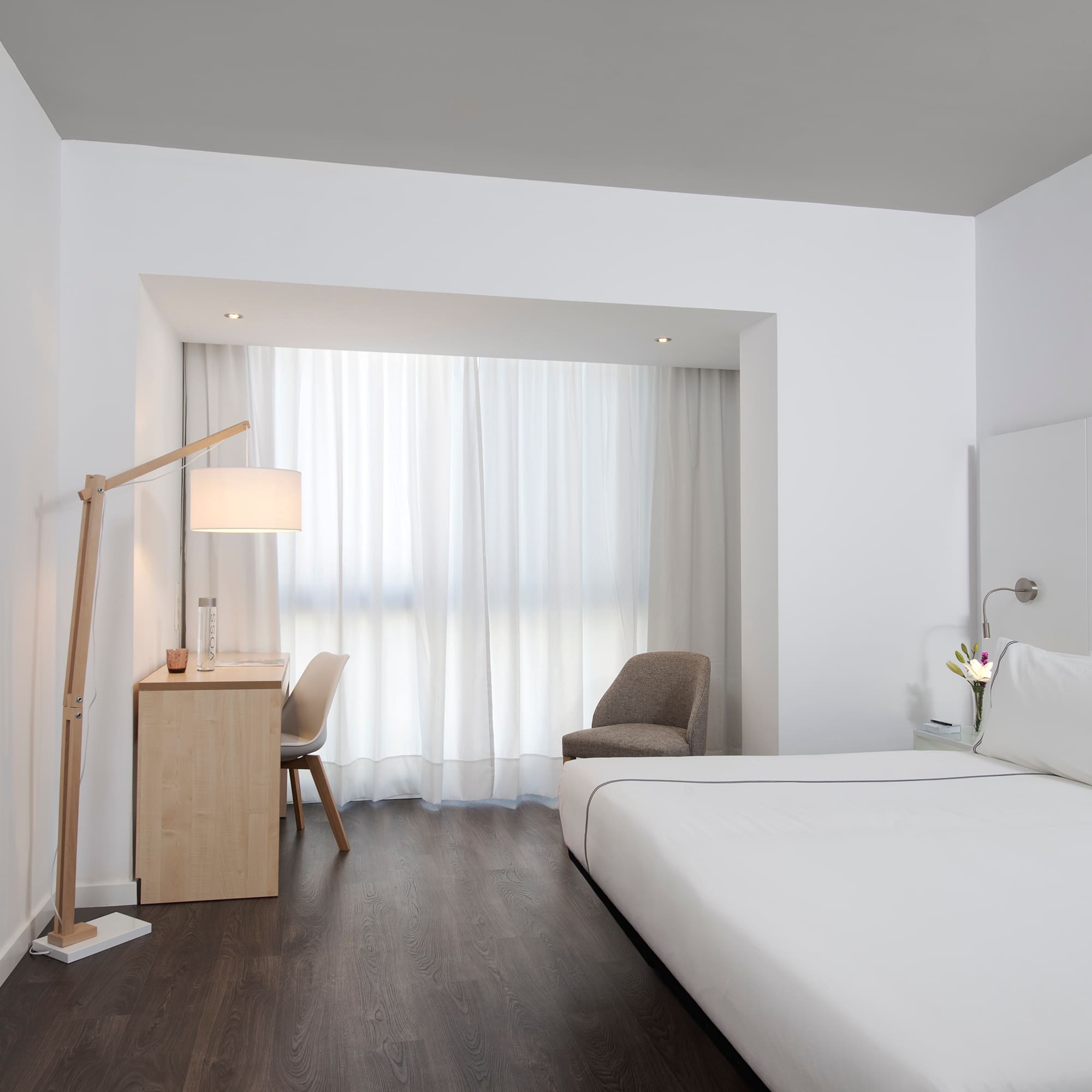 a room with a bed and a desk