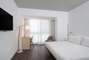 a room with a bed and a desk