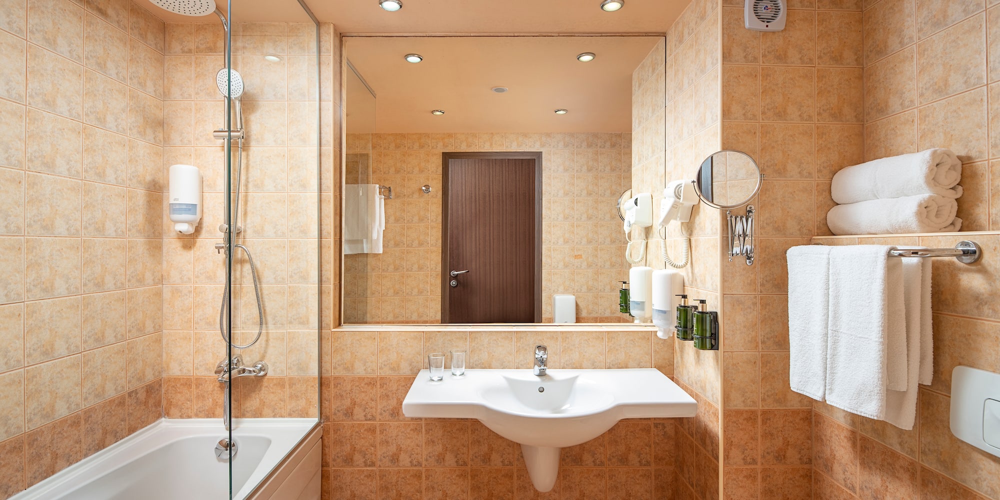 a bathroom with a shower and sink