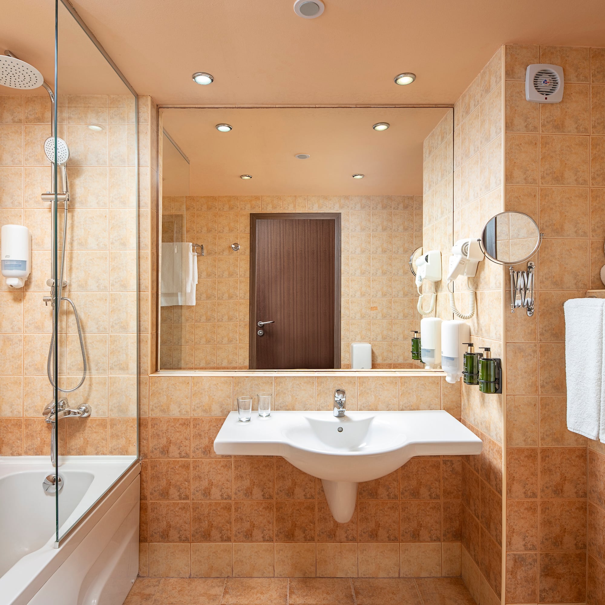 a bathroom with a shower and sink