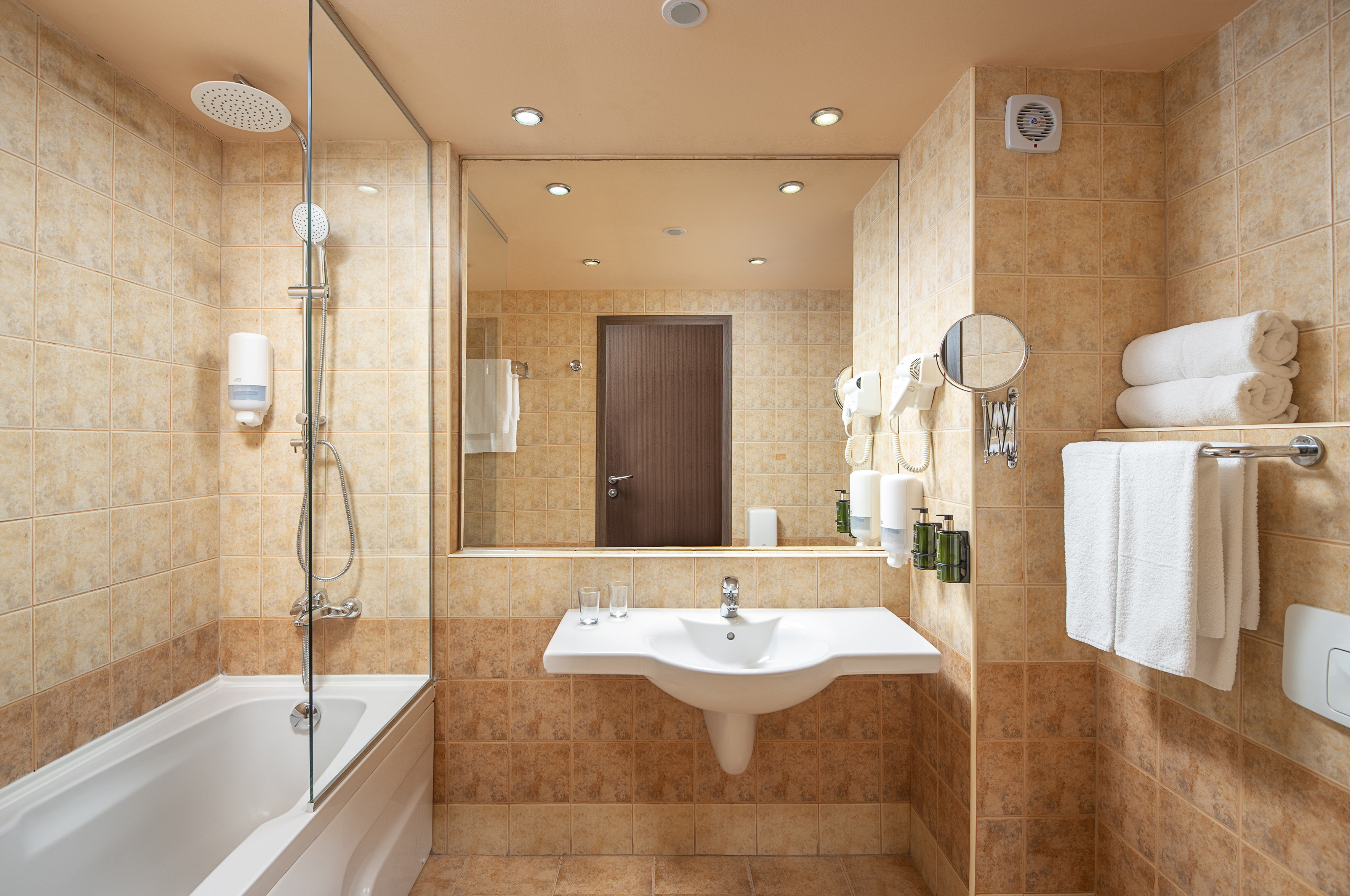 a bathroom with a shower and sink