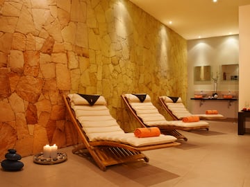 a group of lounge chairs in a room