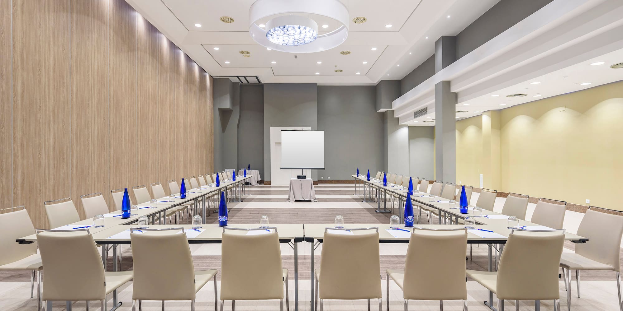 a room with a large table and chairs