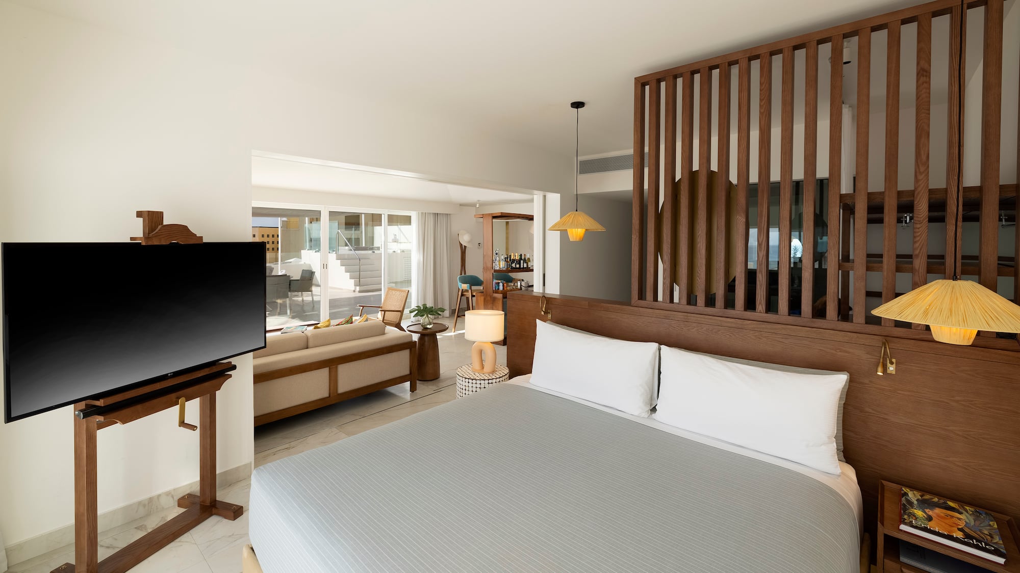 a room with a bed and a television