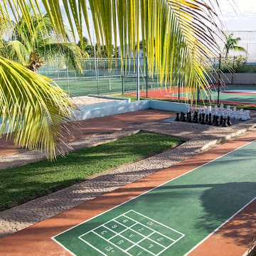 a tennis court with a game of chess