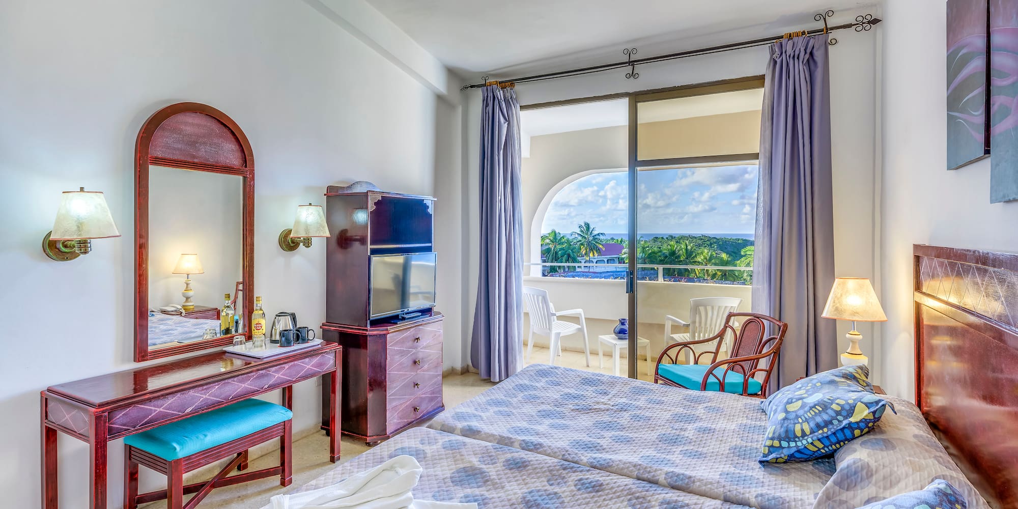 a bedroom with a large window and a bed